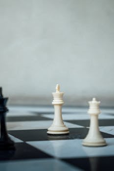 Chess pieces on a checkered board representing strategic gameplay in Ciudad de México.