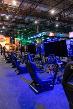 Virtual racing arcade setup with gaming simulators in a vibrant evening ambiance.